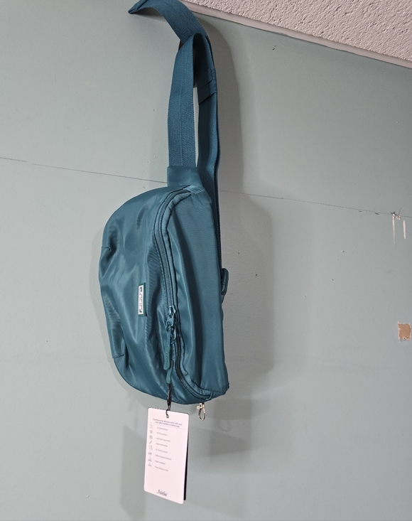 The Foldie Handbags - The Foldie Crossbody Sling Bag Purse Fanny Pack RFID Safe Protection Teal  NWT